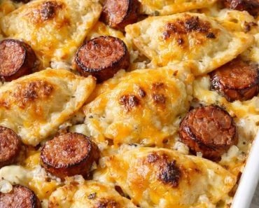 Baked pierogi and kielbasa casserole with melted cheddar