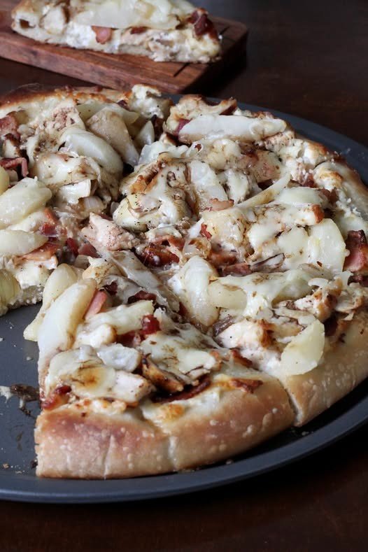 Chicken bacon and pear pizza with creamy white sauce and mozzarella