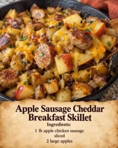 Apple sausage cheddar breakfast skillet with diced apples, golden potatoes, sliced chicken sausage, and melted cheddar