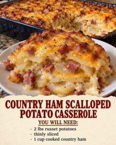 Country ham scalloped potato casserole with layered potatoes, diced ham, and a golden cheddar topping