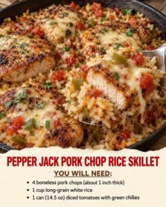 Boneless pork chops over tomato-chile rice with melted pepper jack, using staggered cooking so the chops do not dry out.